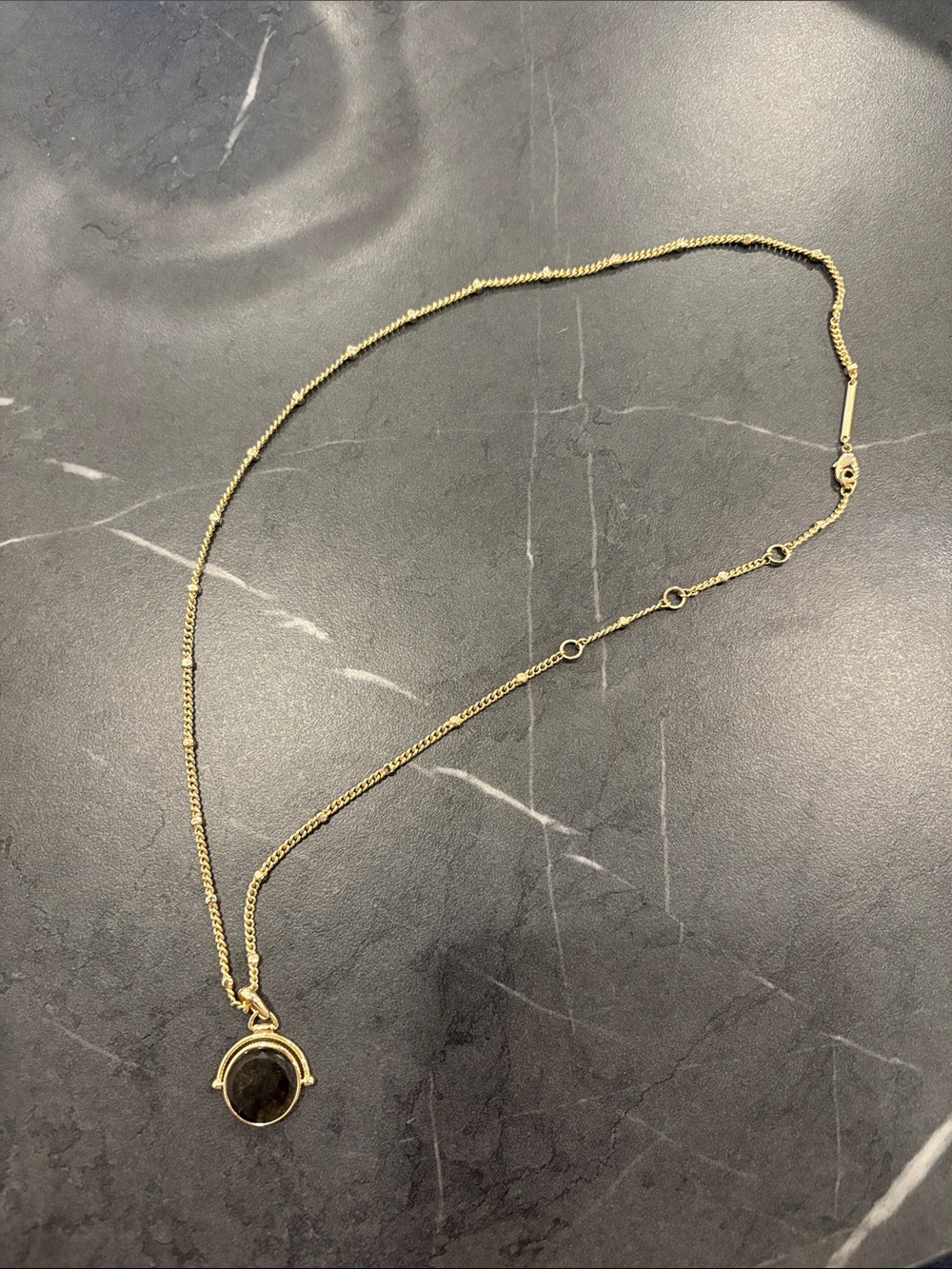 Kendra Scott double sided necklace with black stone pendant